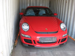 Container with car stuffed and lashed